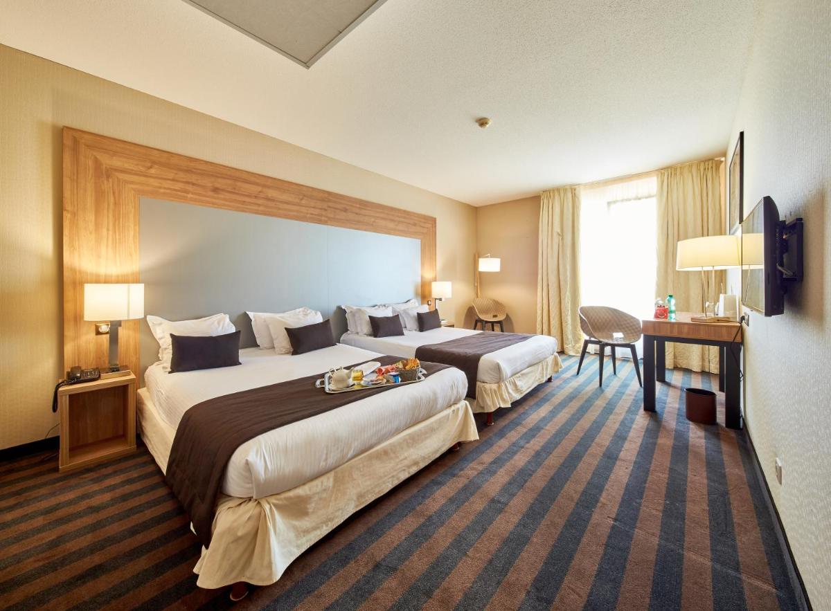Un ou plusieurs lits dans un hébergement de l'établissement 7Hotel&Spa