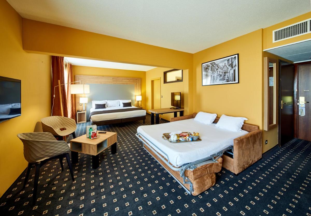 Un ou plusieurs lits dans un hébergement de l'établissement 7Hotel&Spa