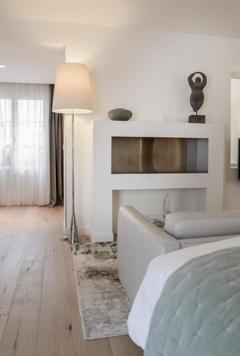 Un ou plusieurs lits dans un hébergement de l'établissement Petit Hôtel Confidentiel