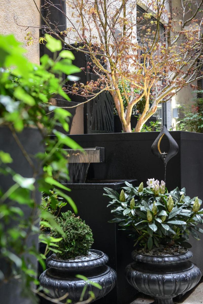 Jardin de l'établissement Petit Hôtel Confidentiel