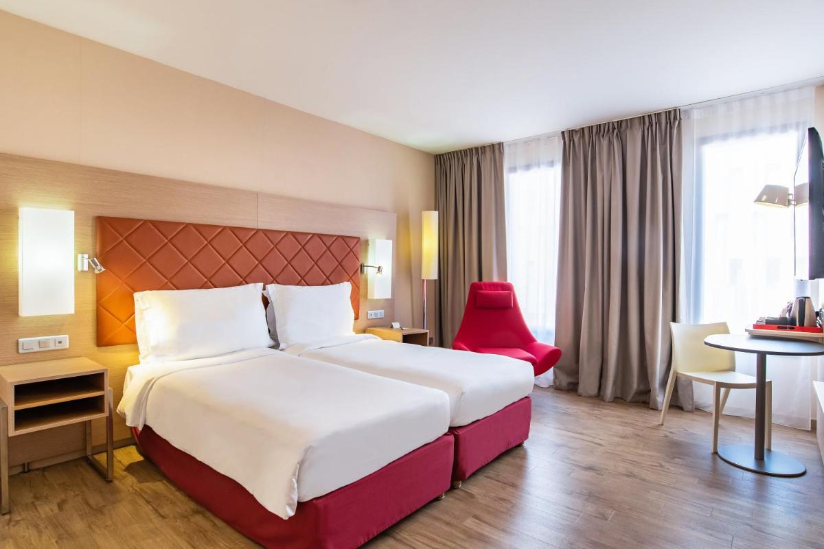Un ou plusieurs lits dans un hébergement de l'établissement Radisson Blu Hotel Toulouse Airport