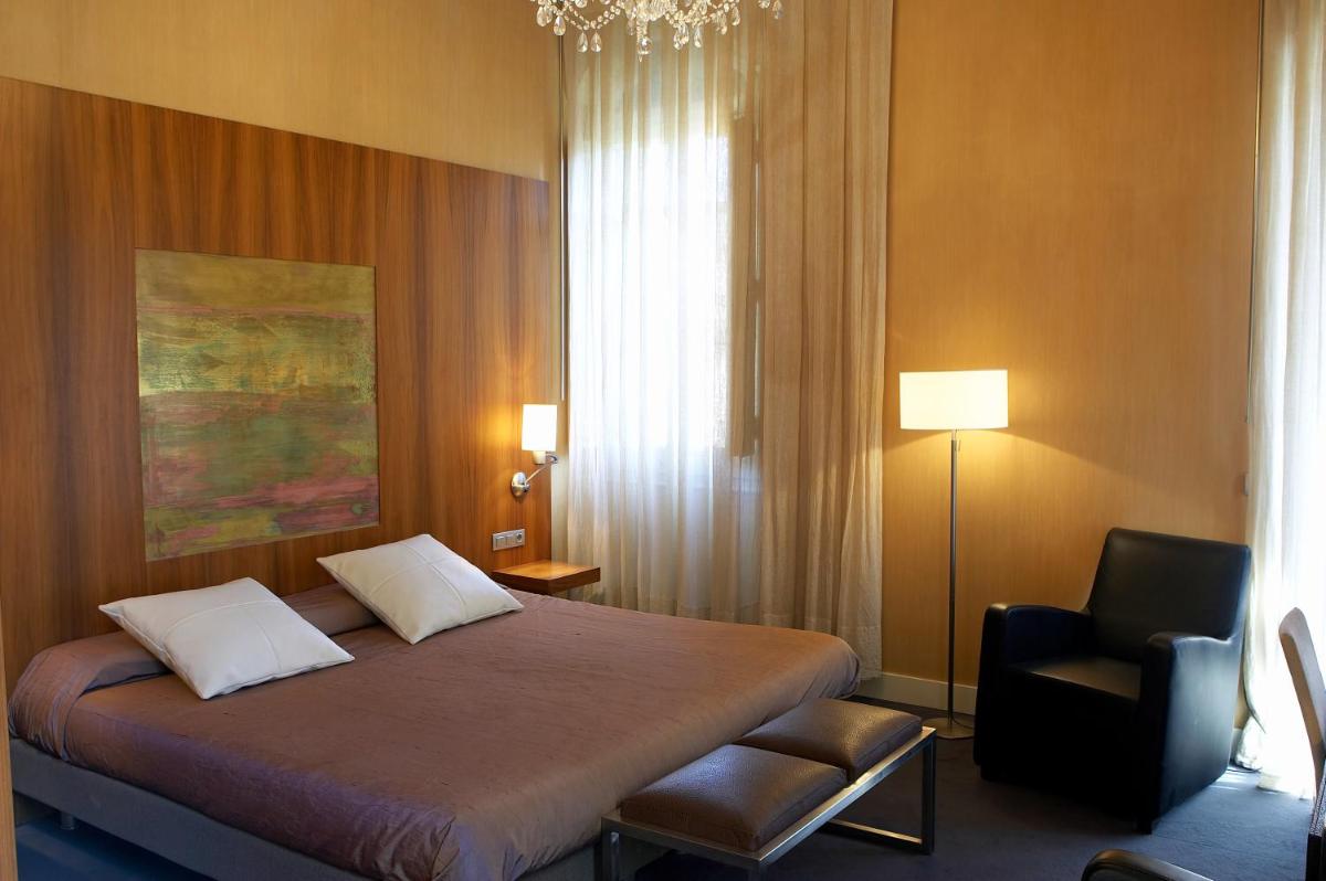 Cama o camas de una habitación en Hotel Sant Roc