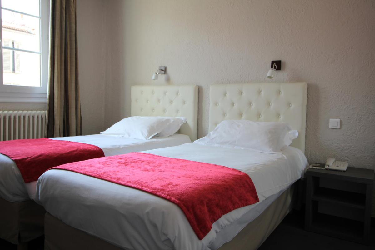 Un ou plusieurs lits dans un hébergement de l'établissement Hôtel Fesch & Spa