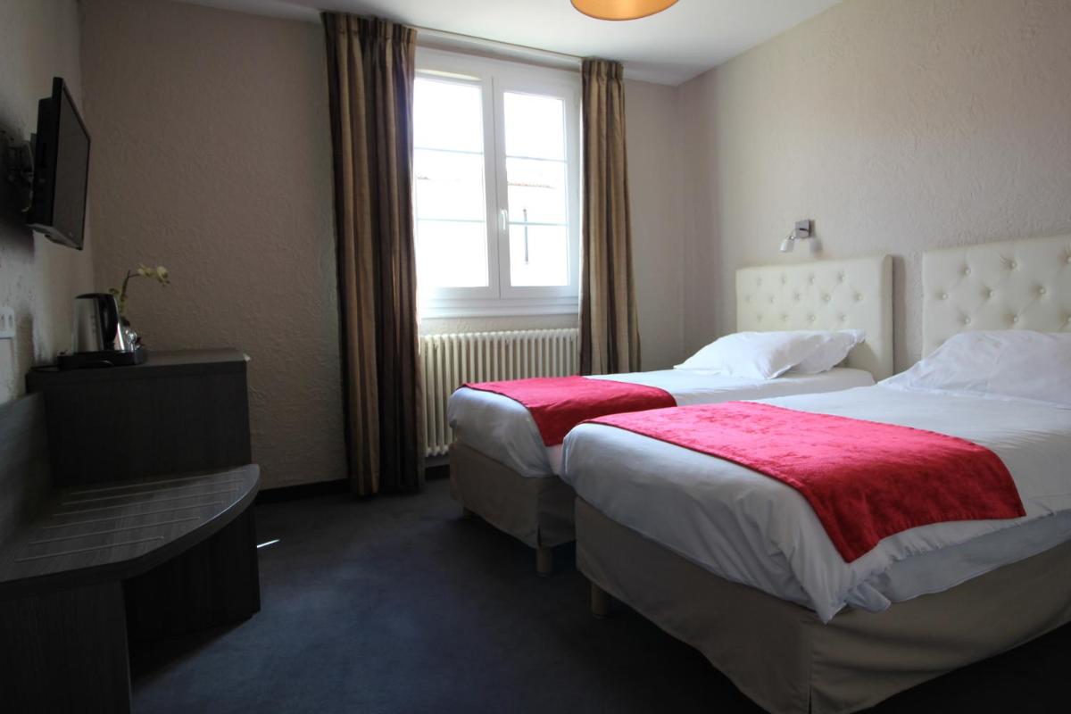 Un ou plusieurs lits dans un hébergement de l'établissement Hôtel Fesch & Spa