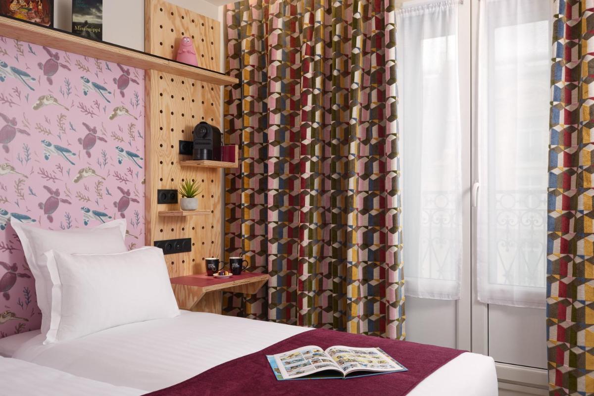 Un ou plusieurs lits dans un hébergement de l'établissement Hotel Locomo - Gare de Lyon Bastille