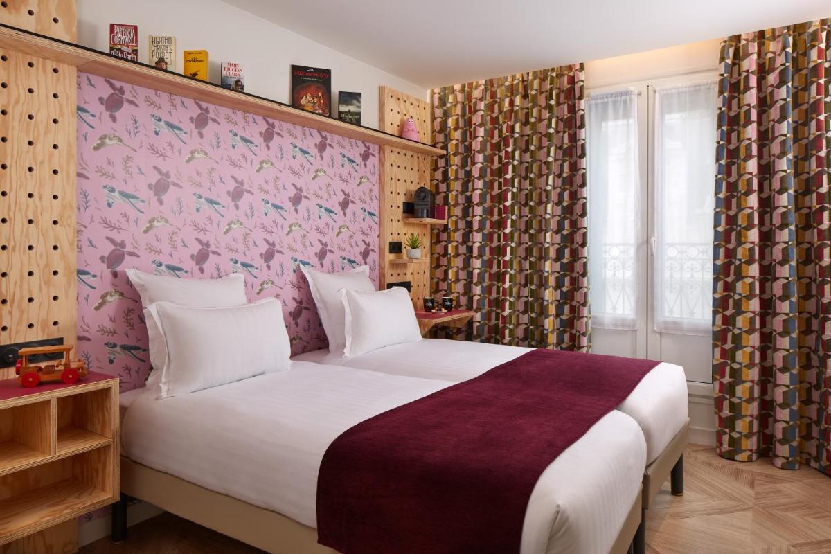 Un ou plusieurs lits dans un hébergement de l'établissement Hotel Locomo - Gare de Lyon Bastille