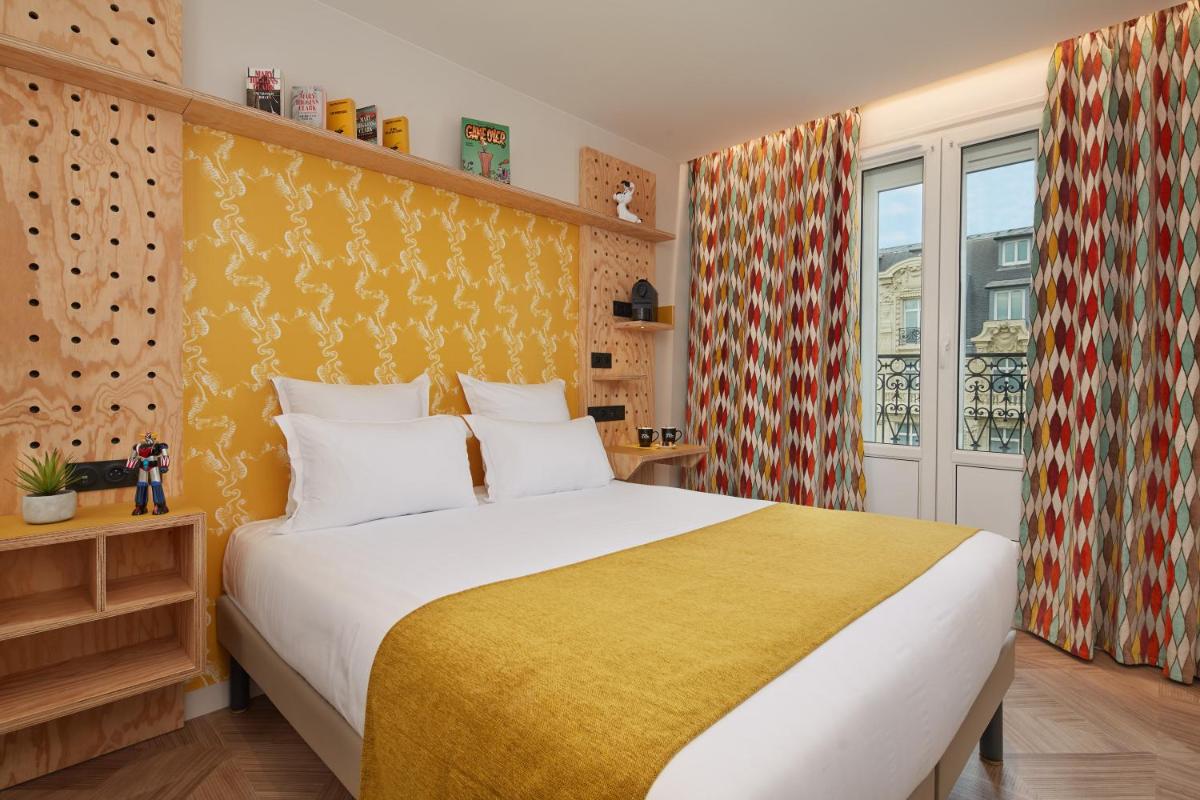 Un ou plusieurs lits dans un hébergement de l'établissement Hotel Locomo - Gare de Lyon Bastille