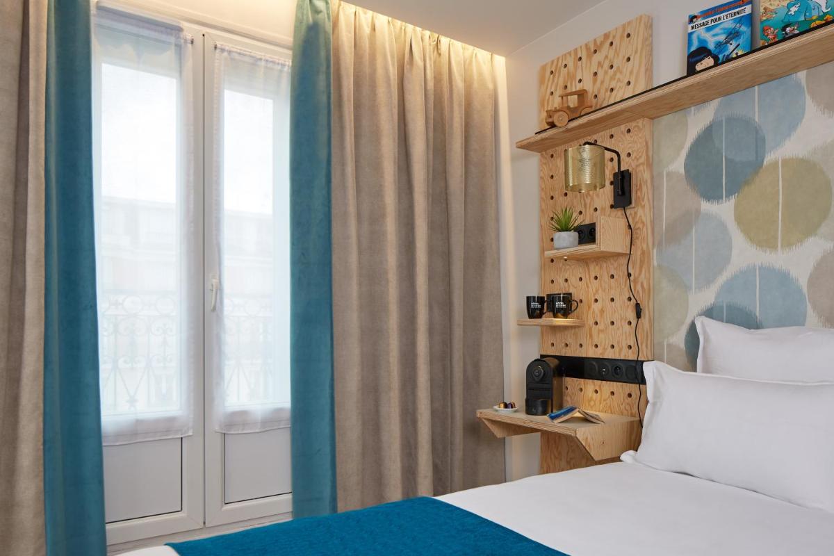 Un ou plusieurs lits dans un hébergement de l'établissement Hotel Locomo - Gare de Lyon Bastille