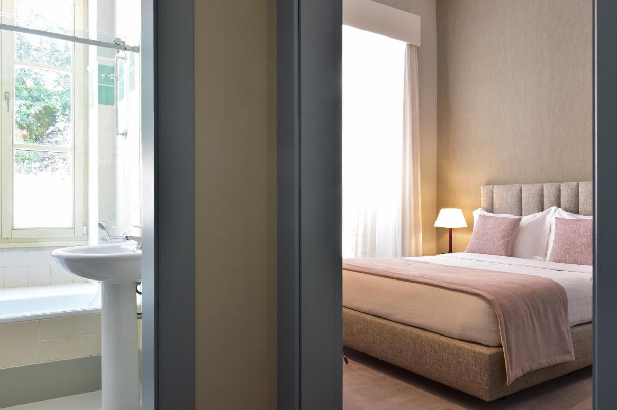 Uma cama ou camas num quarto em Central Monchique Hotel - Villa Termal Spa Resort - by Unlock Hotels