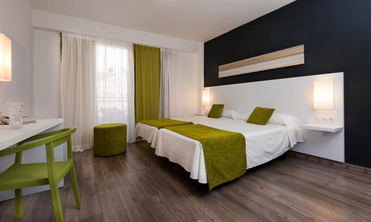 Cama o camas de una habitación en Kn Aparthotel Columbus