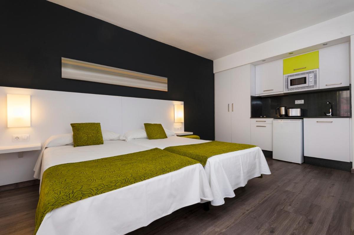 Cama o camas de una habitación en Kn Aparthotel Columbus
