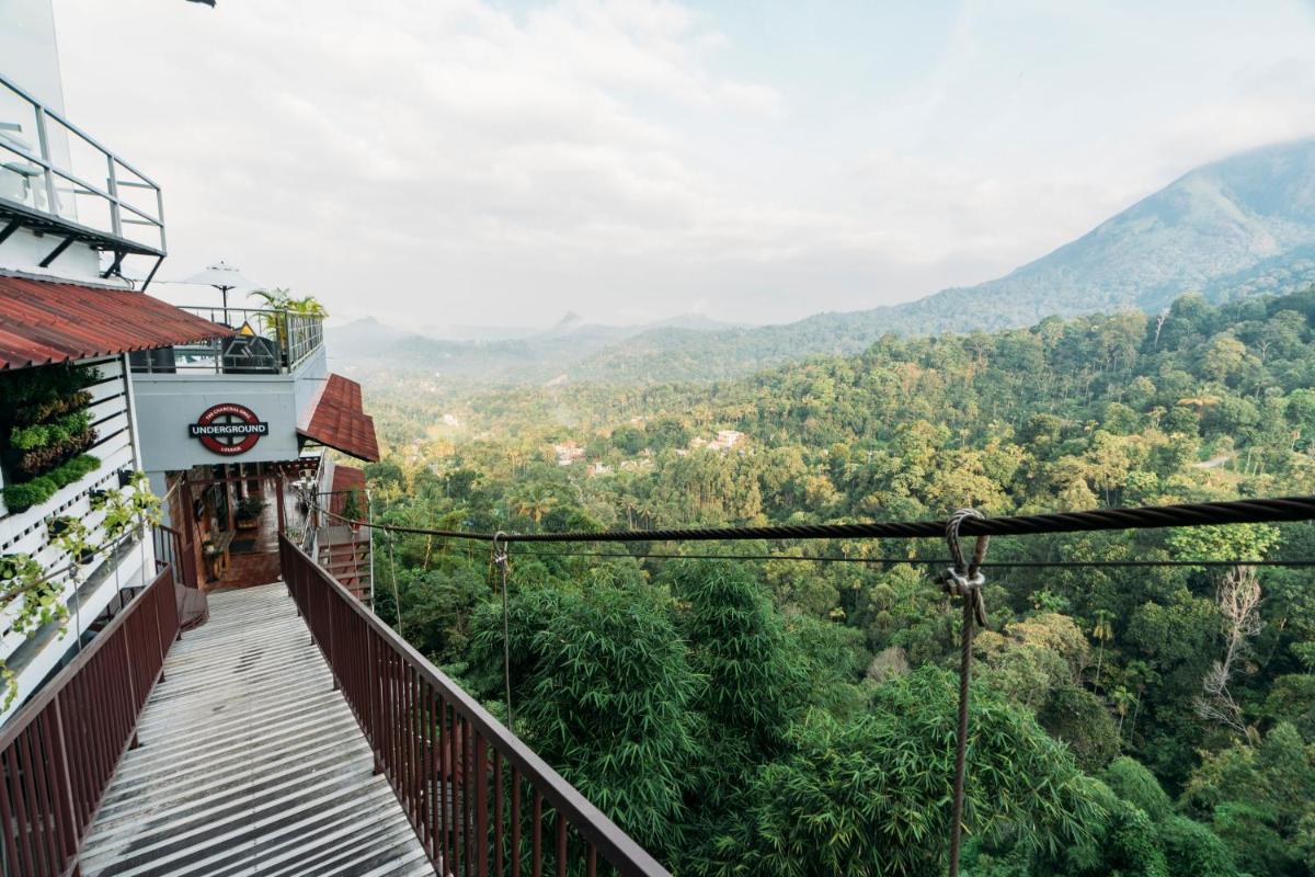 a balcony with a view of the mountains at The Panoramic Getaway in Munnar