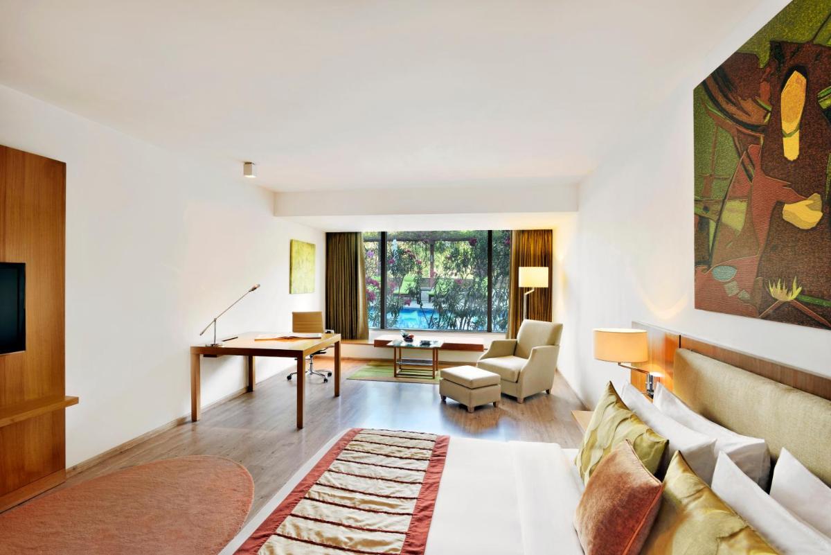 a living room with a couch and a table at Radisson Blu Plaza Hotel Hyderabad Banjara Hills in Hyderabad a living room with a couch and a table at Radisson Blu Plaza Hotel Hyderabad Banjara Hills in Hyderabad