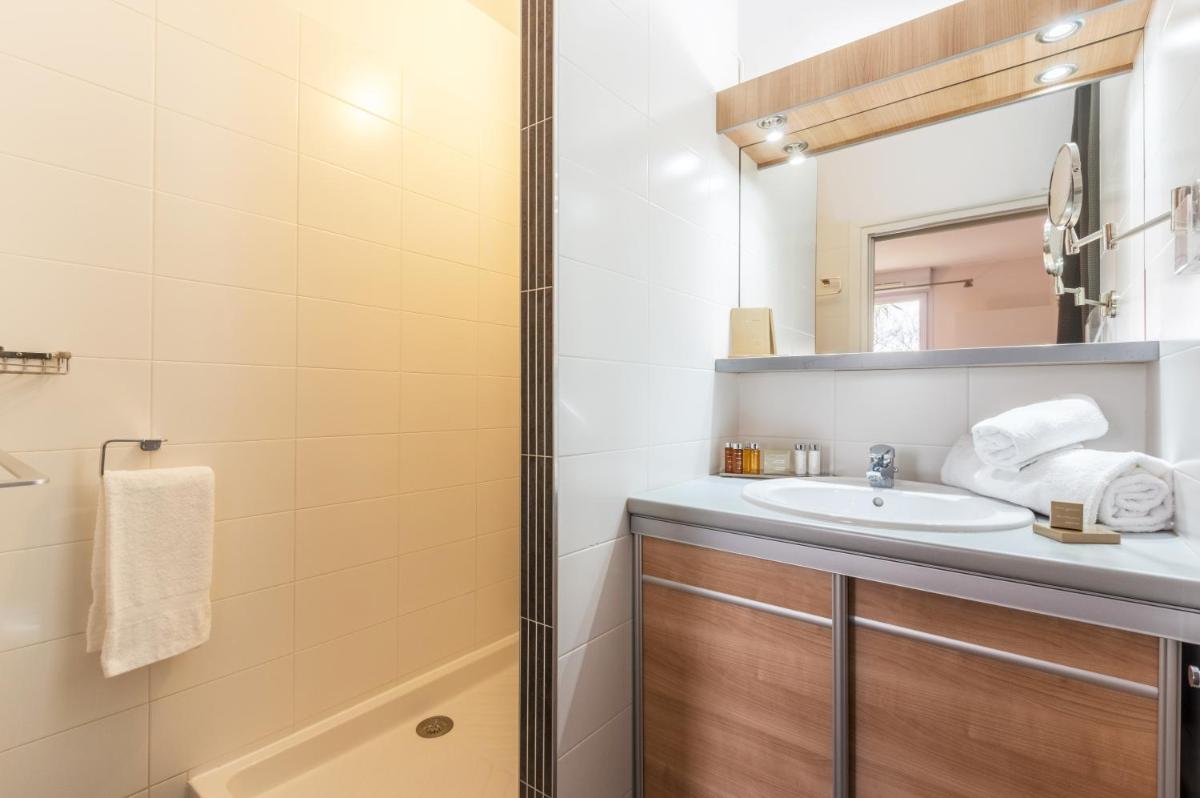 Salle de bains dans l'établissement Résidence Hôtelière Natureva & Spa
