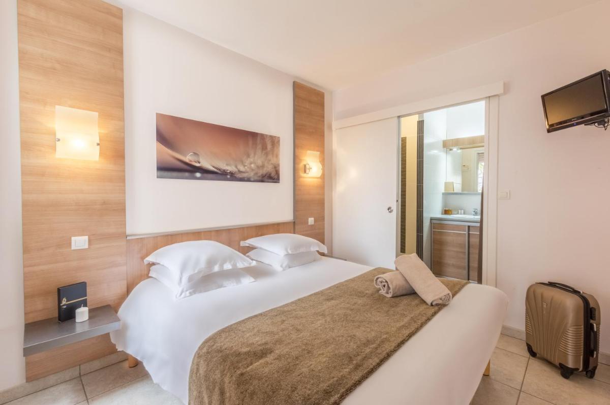 Un ou plusieurs lits dans un hébergement de l'établissement Résidence Hôtelière Natureva & Spa