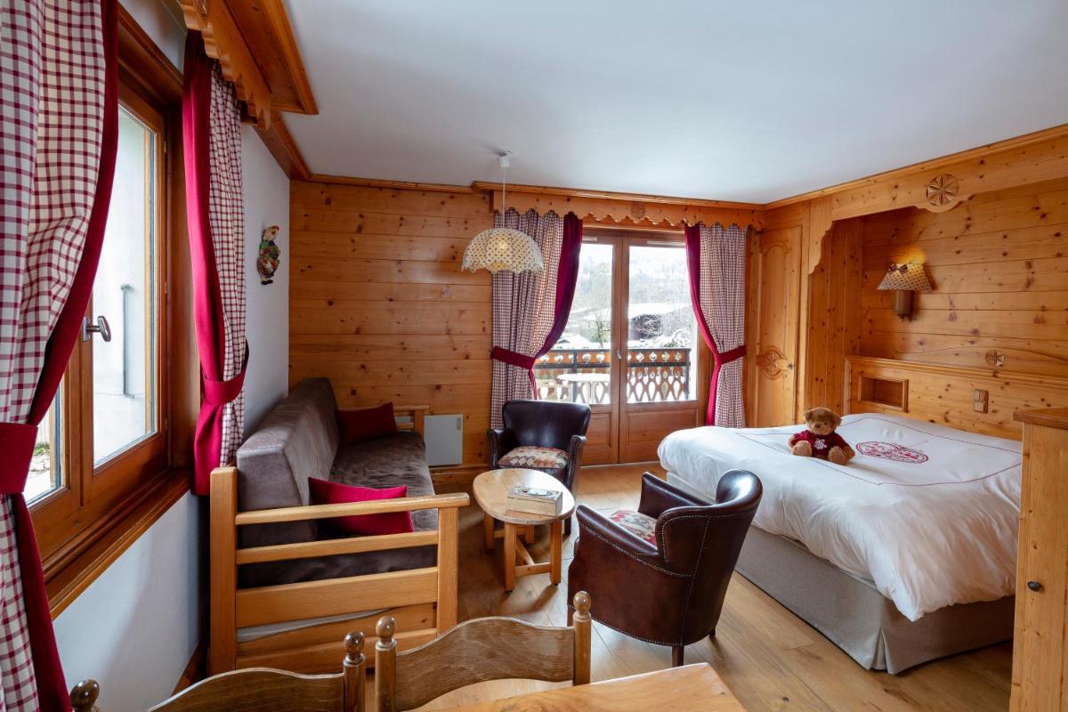Un ou plusieurs lits dans un hébergement de l'établissement Chalet-Hôtel Neige et Roc, The Originals Relais