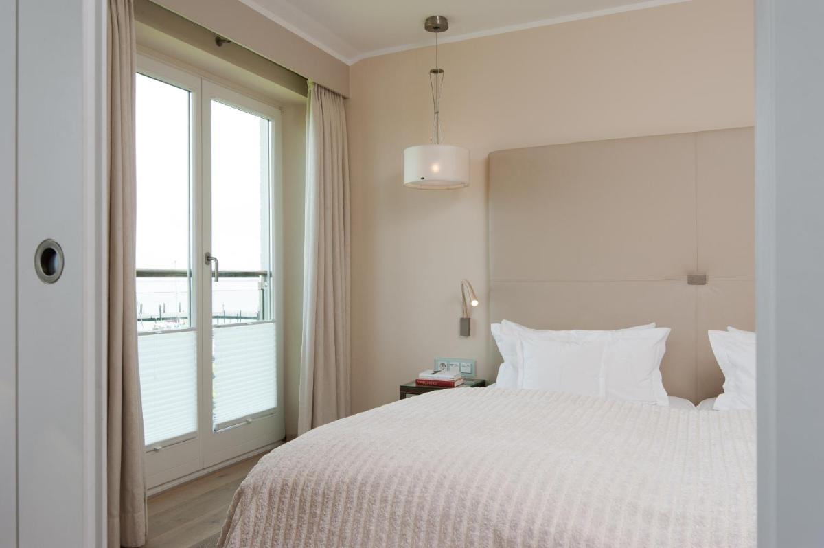 Ein Bett oder Betten in einem Zimmer der Unterkunft Hotel Fährhaus