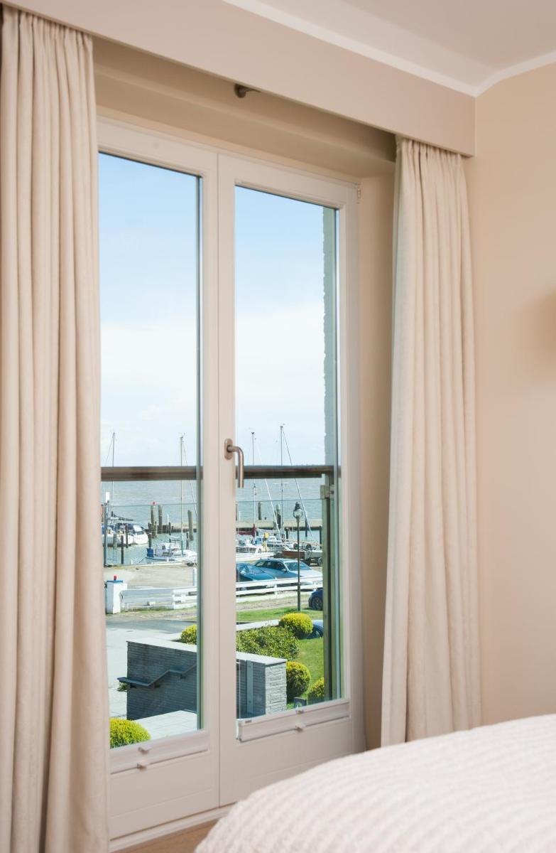 Ein Bett oder Betten in einem Zimmer der Unterkunft Hotel Fährhaus