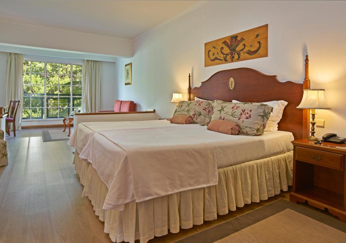 Uma cama ou camas num quarto em Quintinha Sao Joao Hotel & Spa
