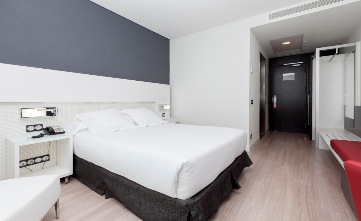 Cama o camas de una habitación en Axor Feria
