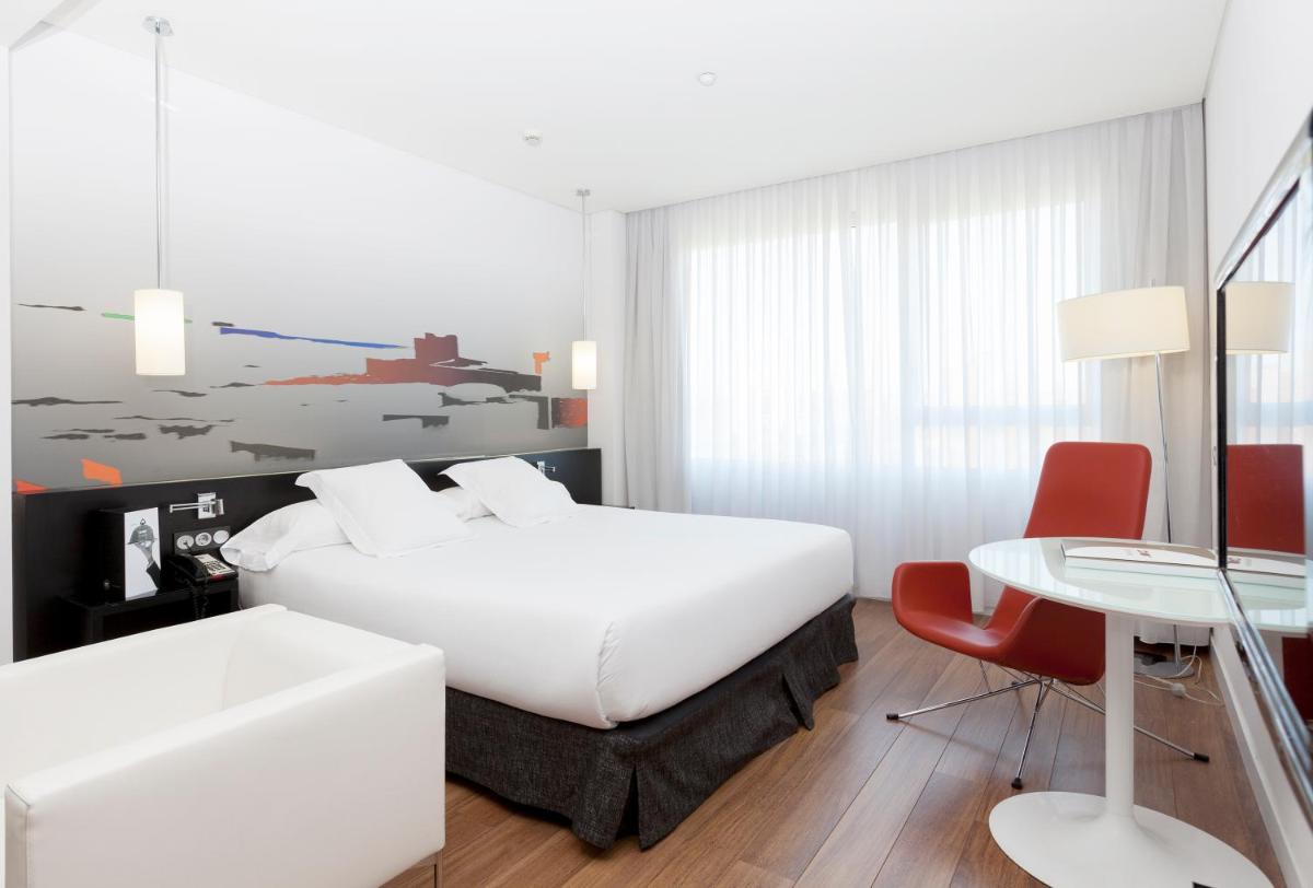 Cama o camas de una habitación en Axor Barajas