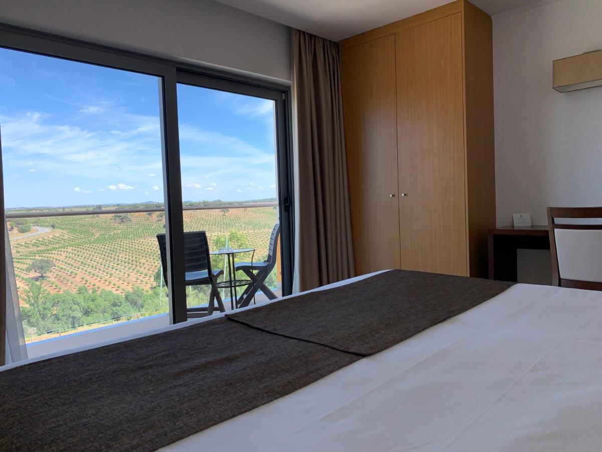Uma cama ou camas num quarto em Hotel O Gato & Spa