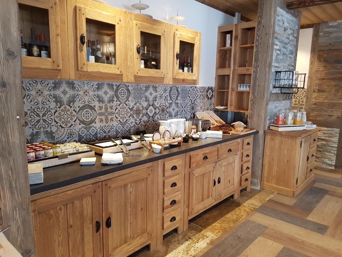 Cuisine ou kitchenette dans l'établissement Chalet Marano Restaurant & Spa