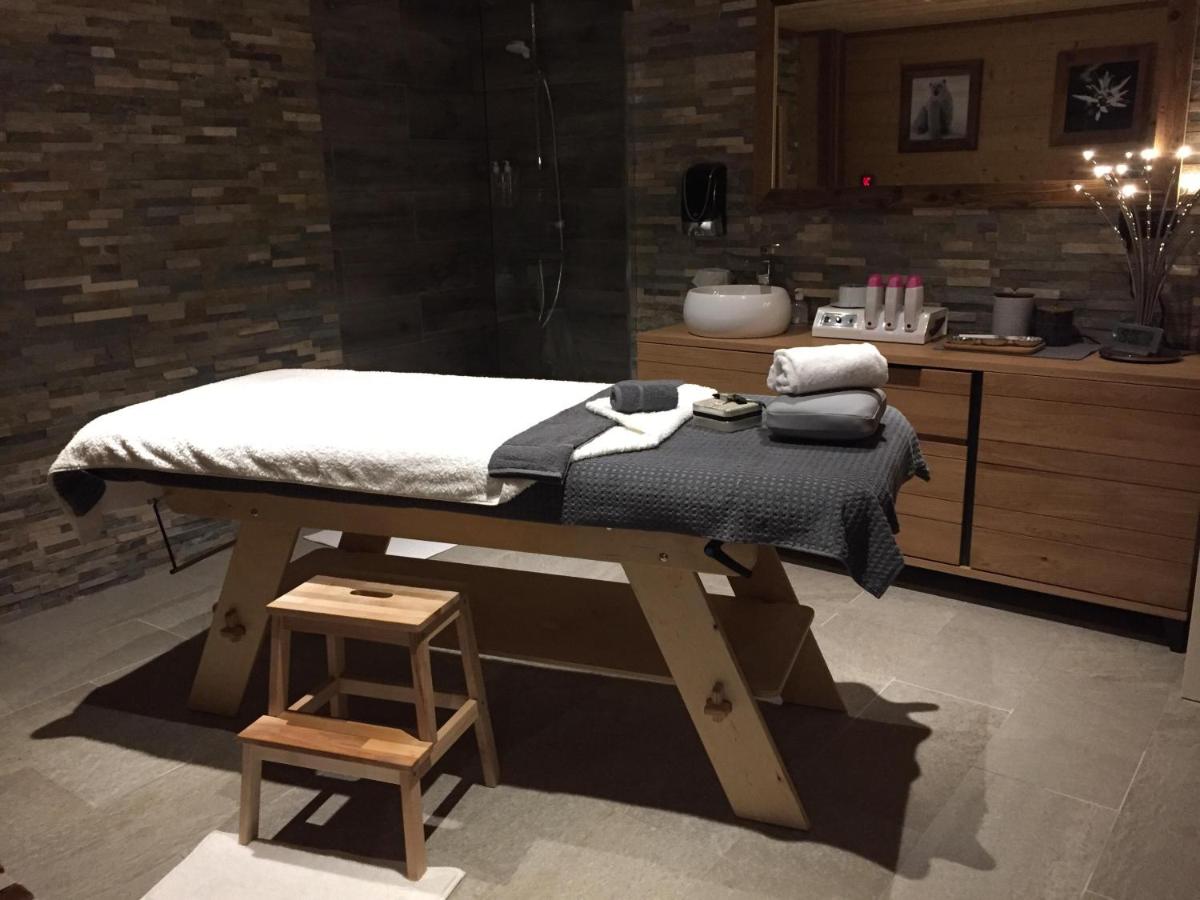 Un ou plusieurs lits dans un hébergement de l'établissement Chalet Marano Restaurant & Spa