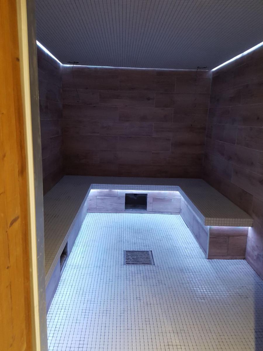 Un ou plusieurs lits dans un hébergement de l'établissement Chalet Marano Restaurant & Spa