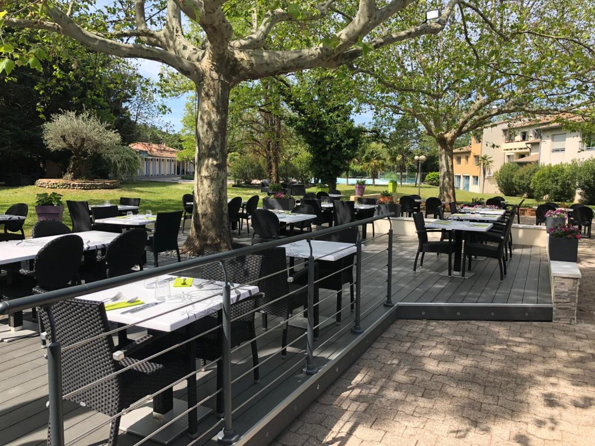 Restaurant ou autre lieu de restauration dans l'établissement Logis Hotel Restaurant SPA Les Oliviers