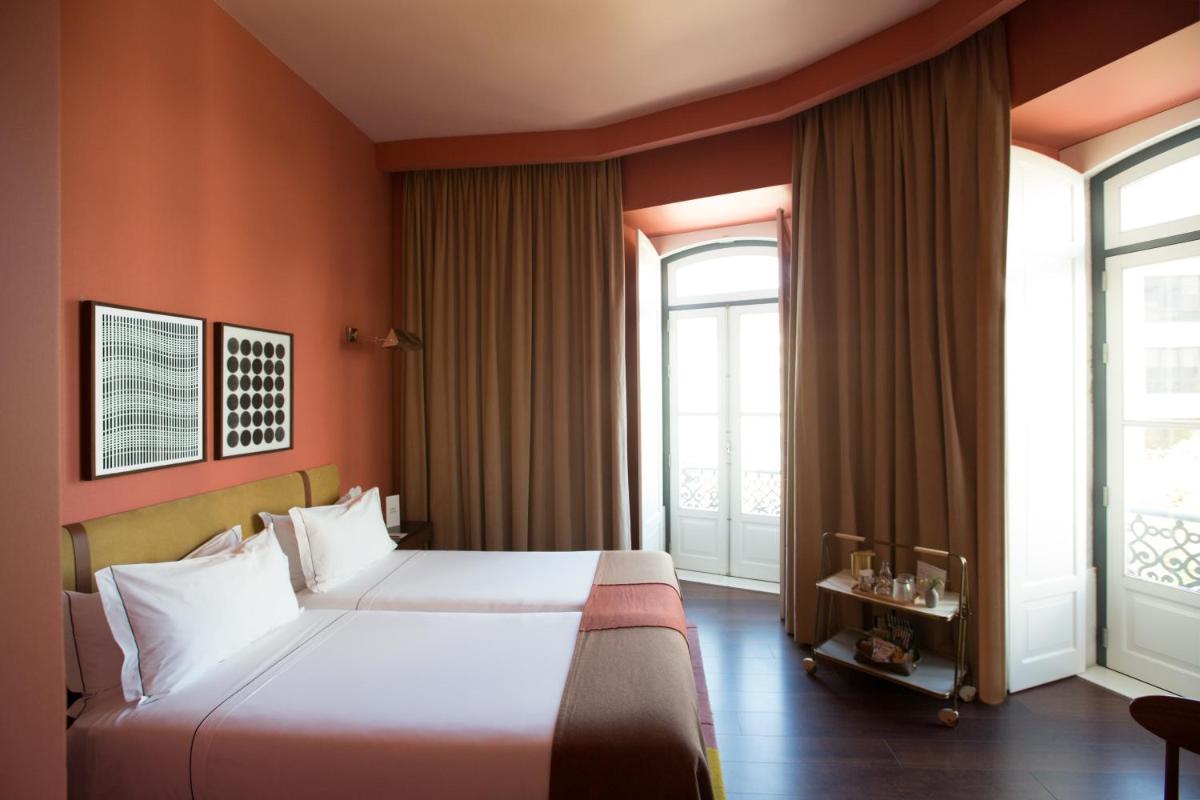 Uma cama ou camas num quarto em The Vintage Hotel & Spa Lisbon
