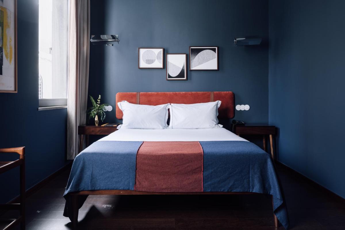 Uma cama ou camas num quarto em The Vintage Hotel & Spa Lisbon