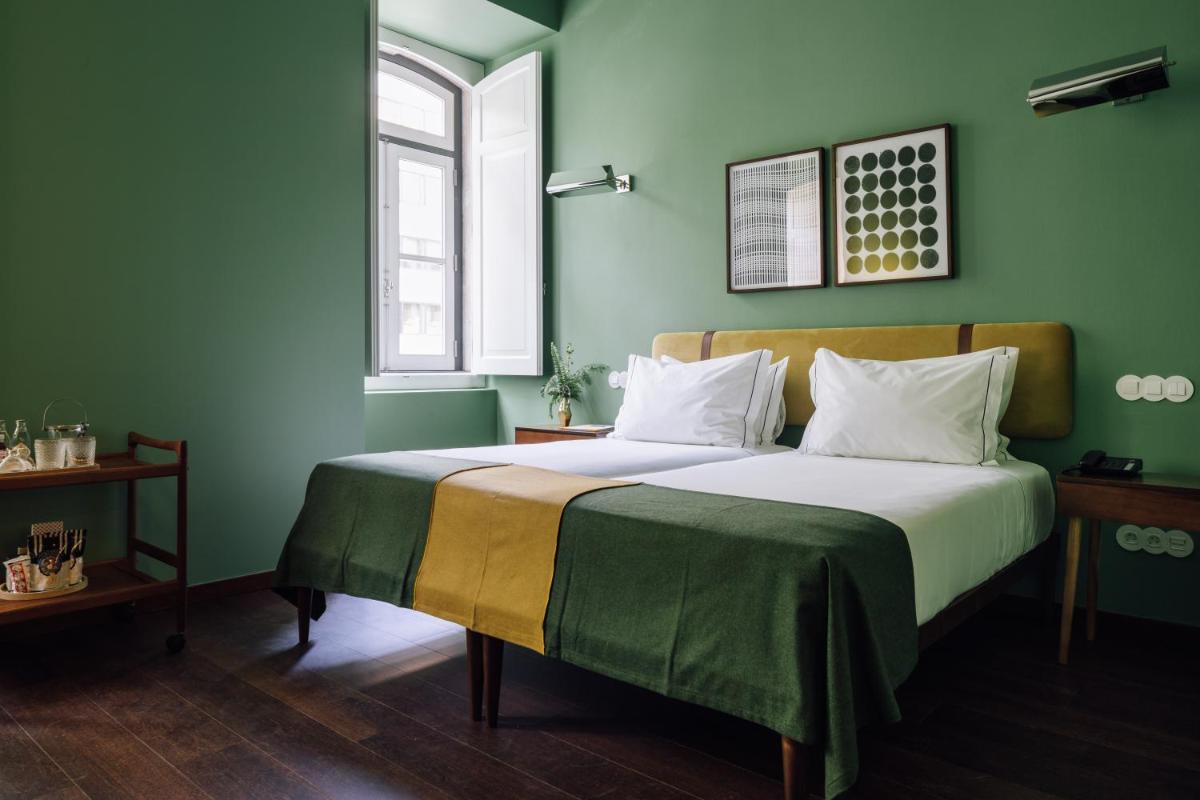 Uma cama ou camas num quarto em The Vintage Hotel & Spa Lisbon