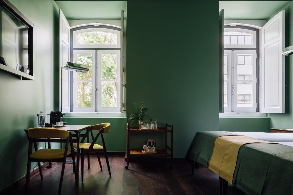 Uma cama ou camas num quarto em The Vintage Hotel & Spa Lisbon