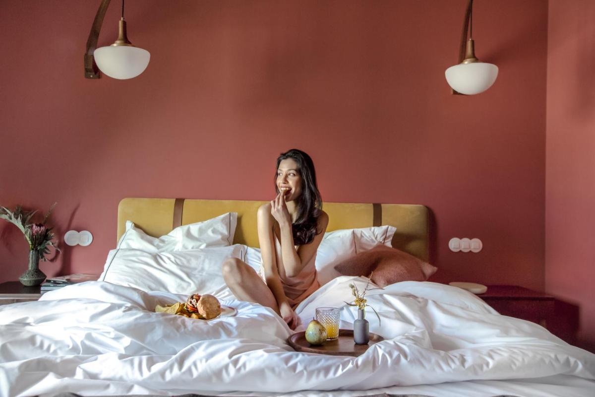 Uma cama ou camas num quarto em The Vintage Hotel & Spa Lisbon