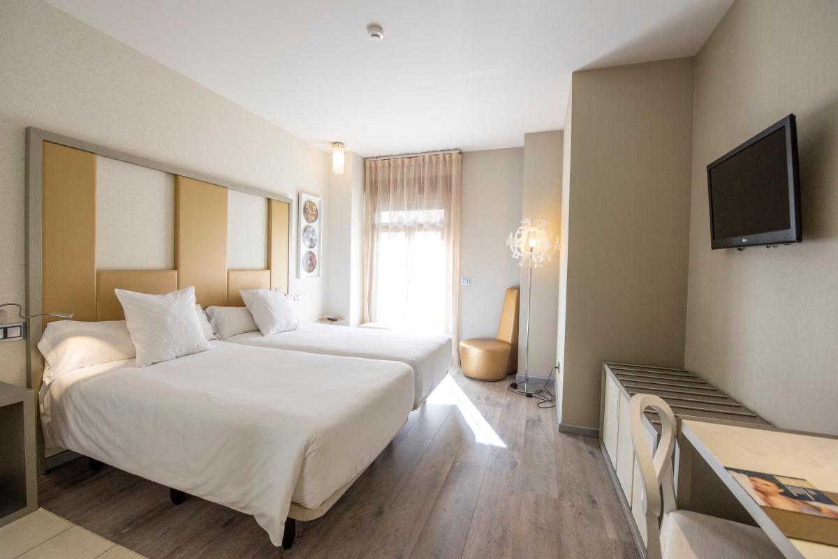 Cama o camas de una habitación en Hotel & Spa Princesa Munia