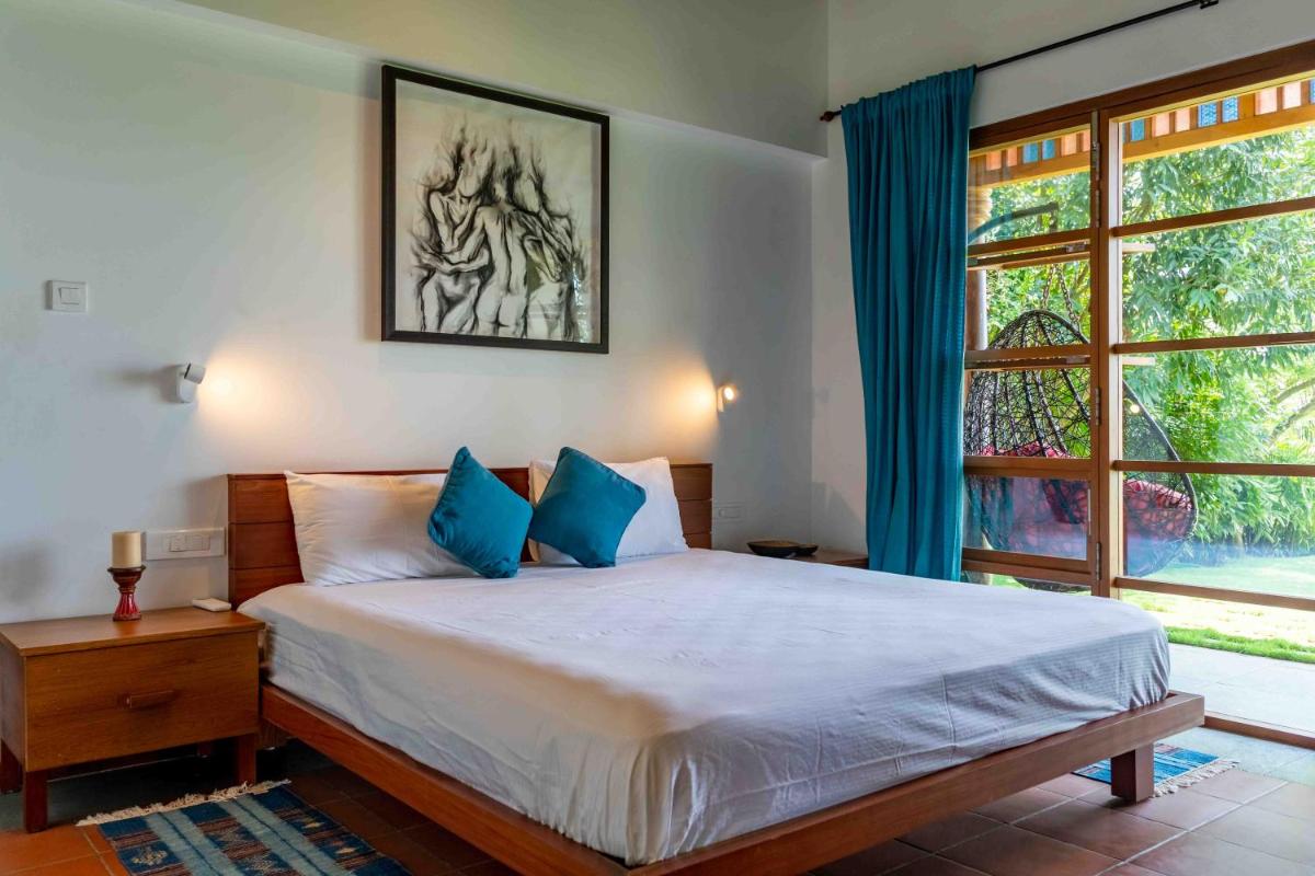 Cheppanam House with Backwater View and Pvt Lawn by StayVista - Housity