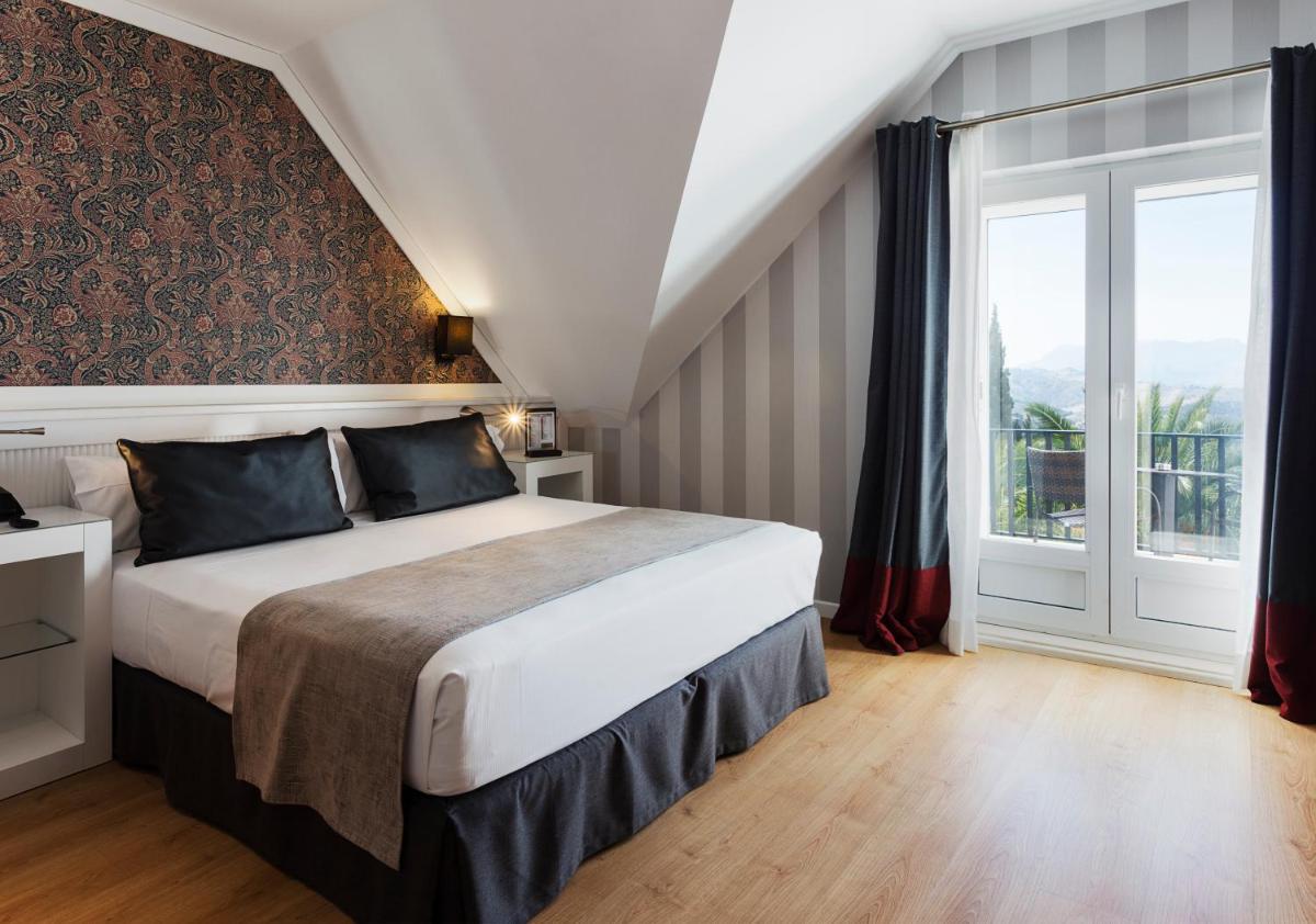 Cama o camas de una habitación en Catalonia Reina Victoria