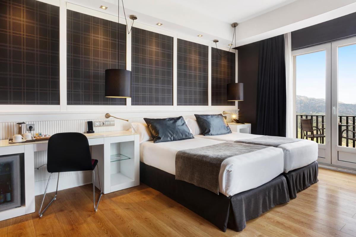 Cama o camas de una habitación en Catalonia Reina Victoria