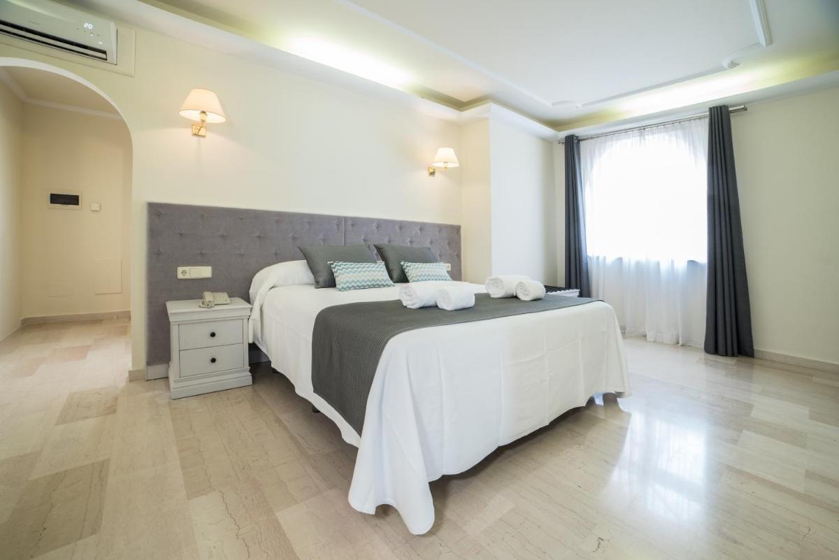 Cama o camas de una habitación en Grand Hotel Palladium Santa Eulalia del Río