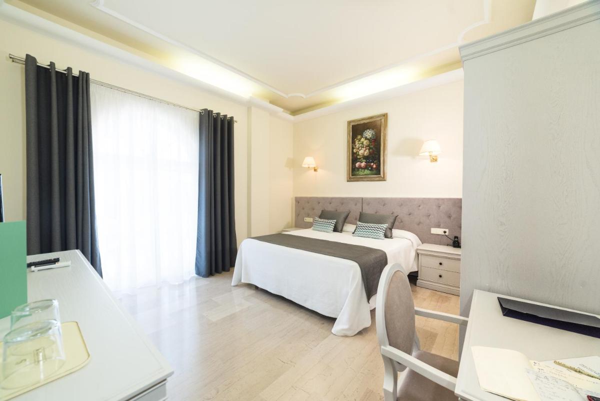 Cama o camas de una habitación en Grand Hotel Palladium Santa Eulalia del Río