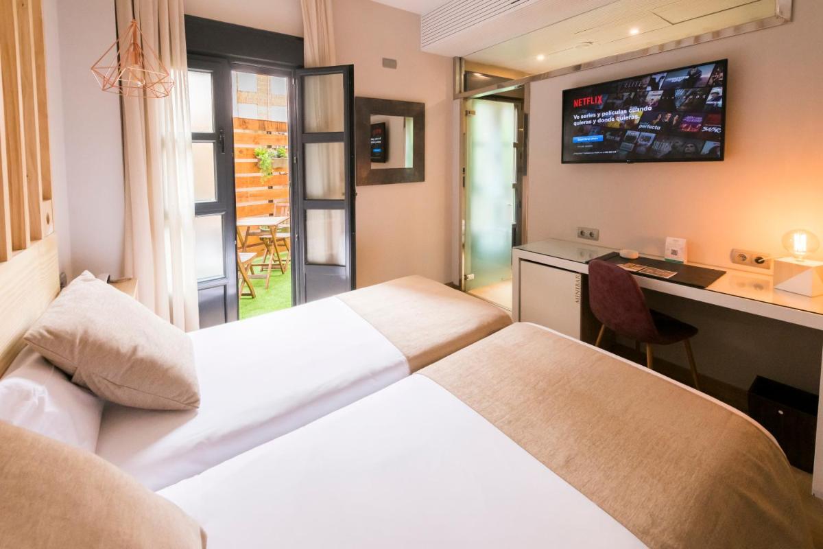 Cama o camas de una habitación en Hotel Fruela