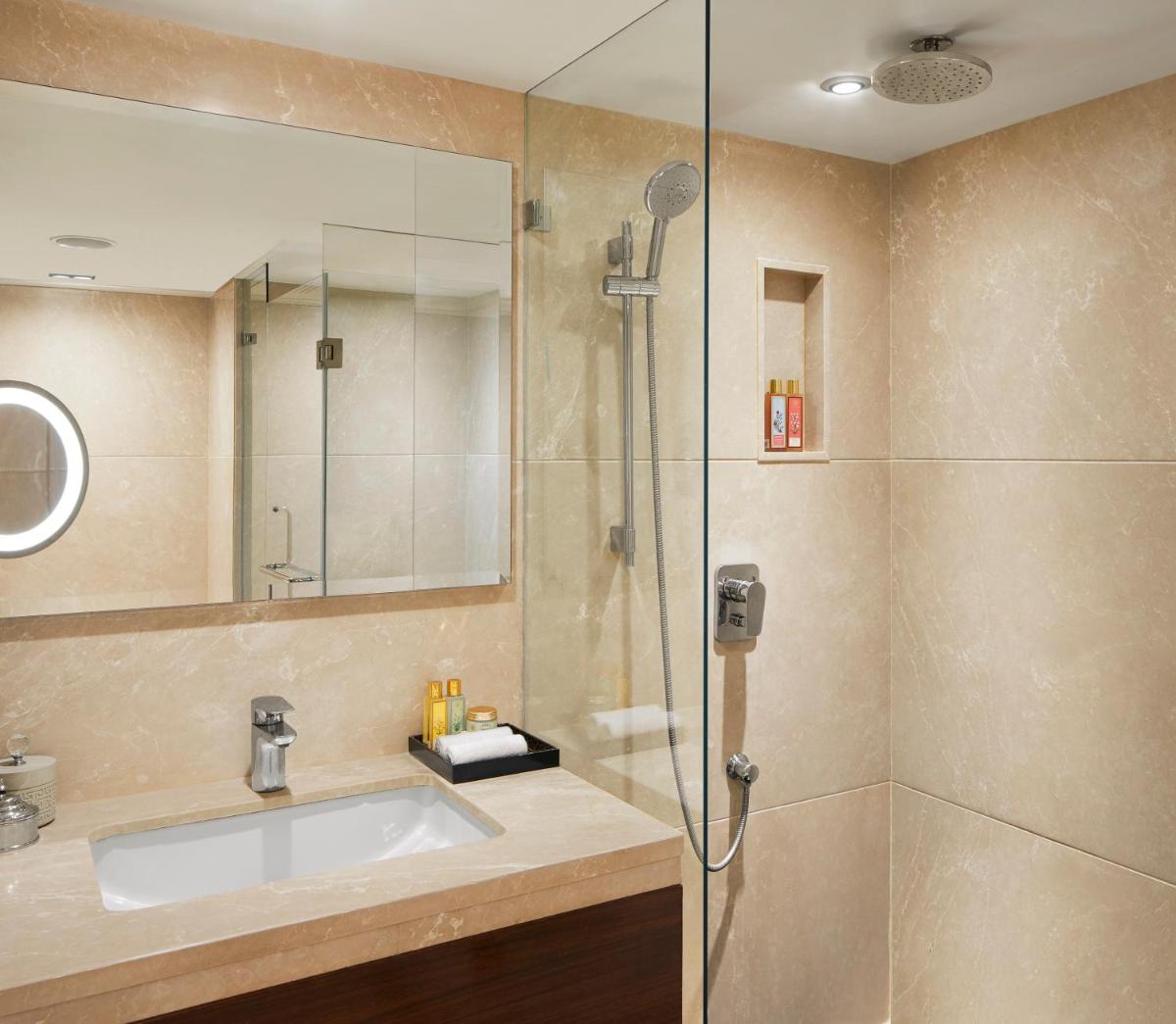 a bathroom with a sink and a shower at President - IHCL SeleQtions in Mumbai