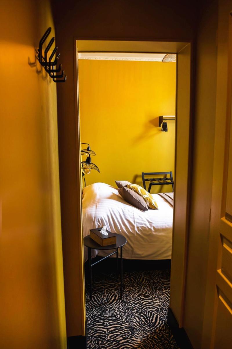 Un ou plusieurs lits dans un hébergement de l'établissement La villa 10 HÔTEL SPA