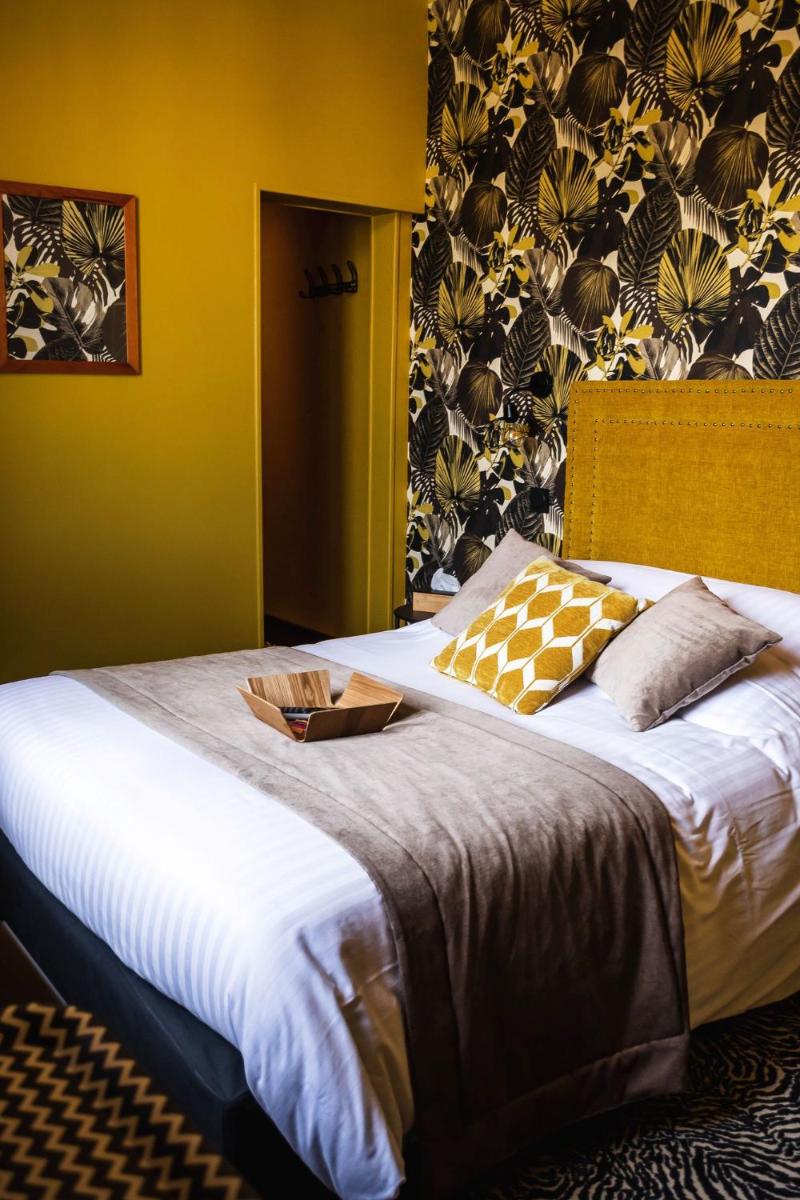 Un ou plusieurs lits dans un hébergement de l'établissement La villa 10 HÔTEL SPA