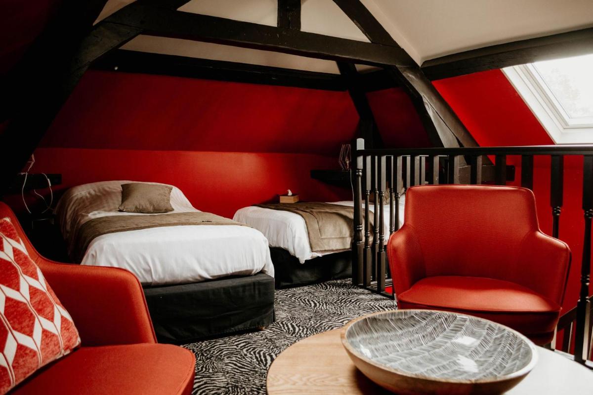 Un ou plusieurs lits dans un hébergement de l'établissement La villa 10 HÔTEL SPA