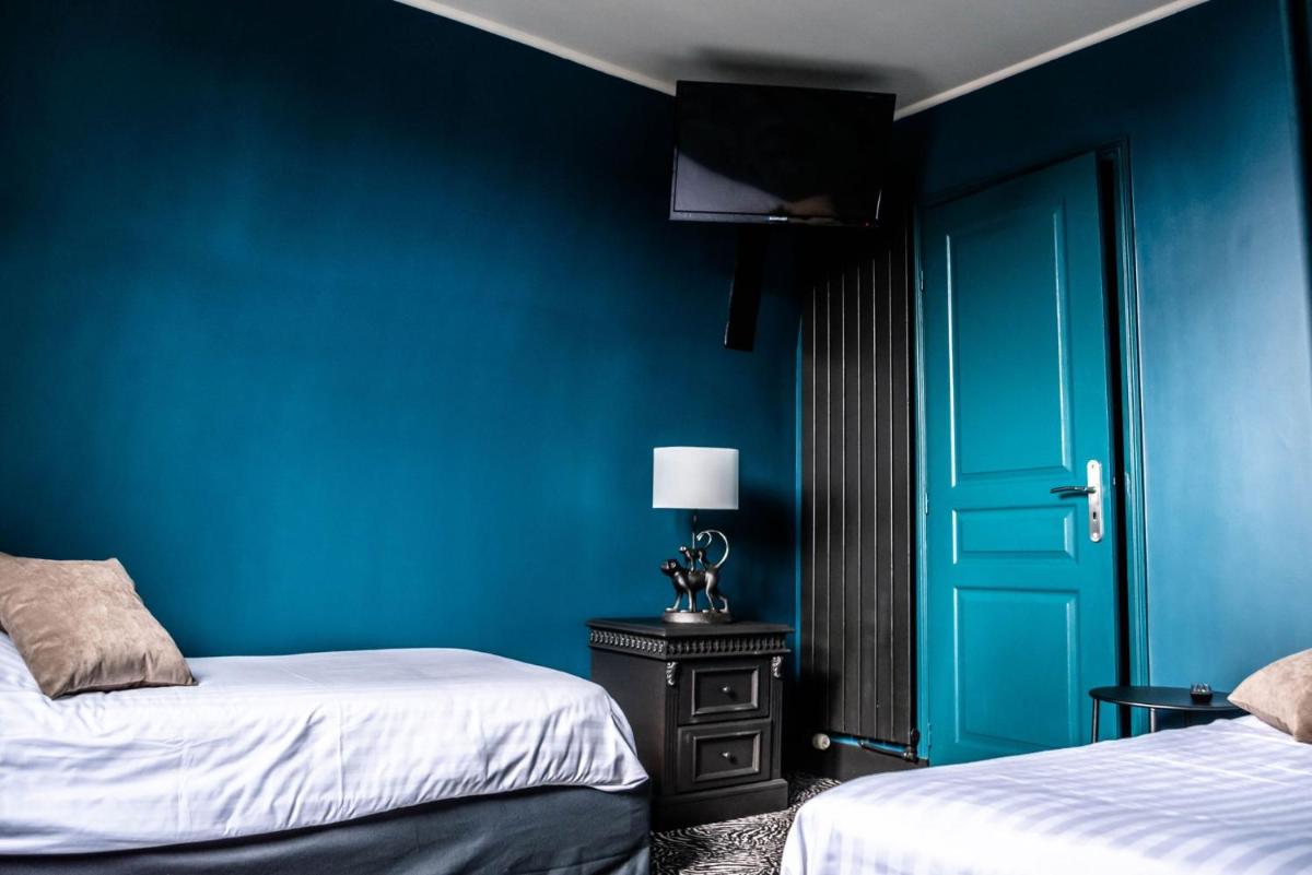 Un ou plusieurs lits dans un hébergement de l'établissement La villa 10 HÔTEL SPA