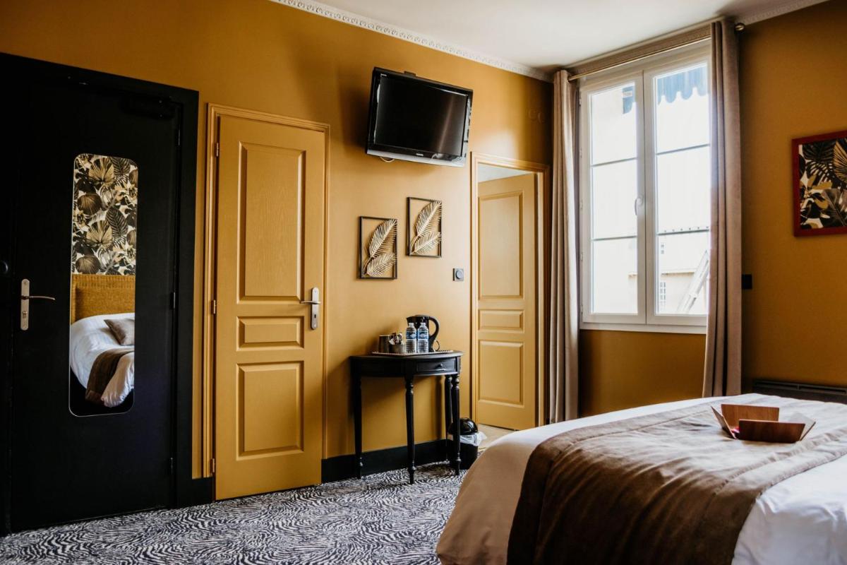 Un ou plusieurs lits dans un hébergement de l'établissement La villa 10 HÔTEL SPA