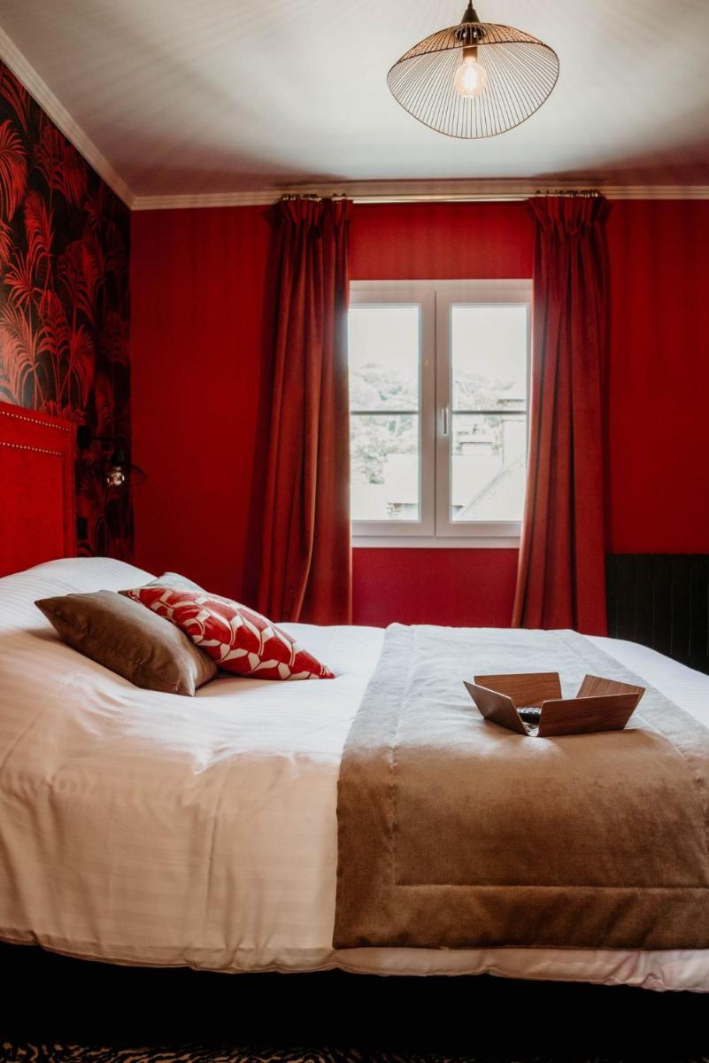 Un ou plusieurs lits dans un hébergement de l'établissement La villa 10 HÔTEL SPA