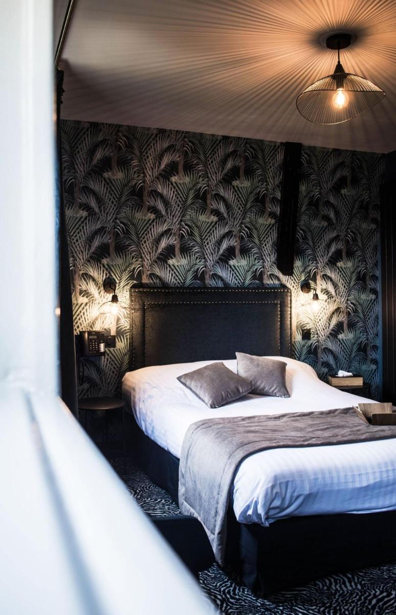 Un ou plusieurs lits dans un hébergement de l'établissement La villa 10 HÔTEL SPA